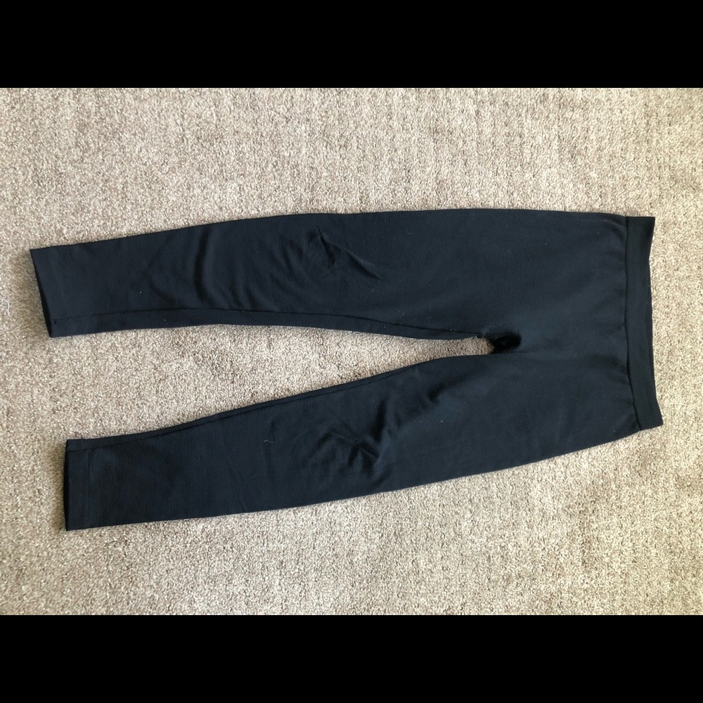 Woman’s black thick knit leggings